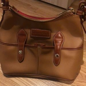 Like new Dooney and Bourke leather purse; color is Carmel color